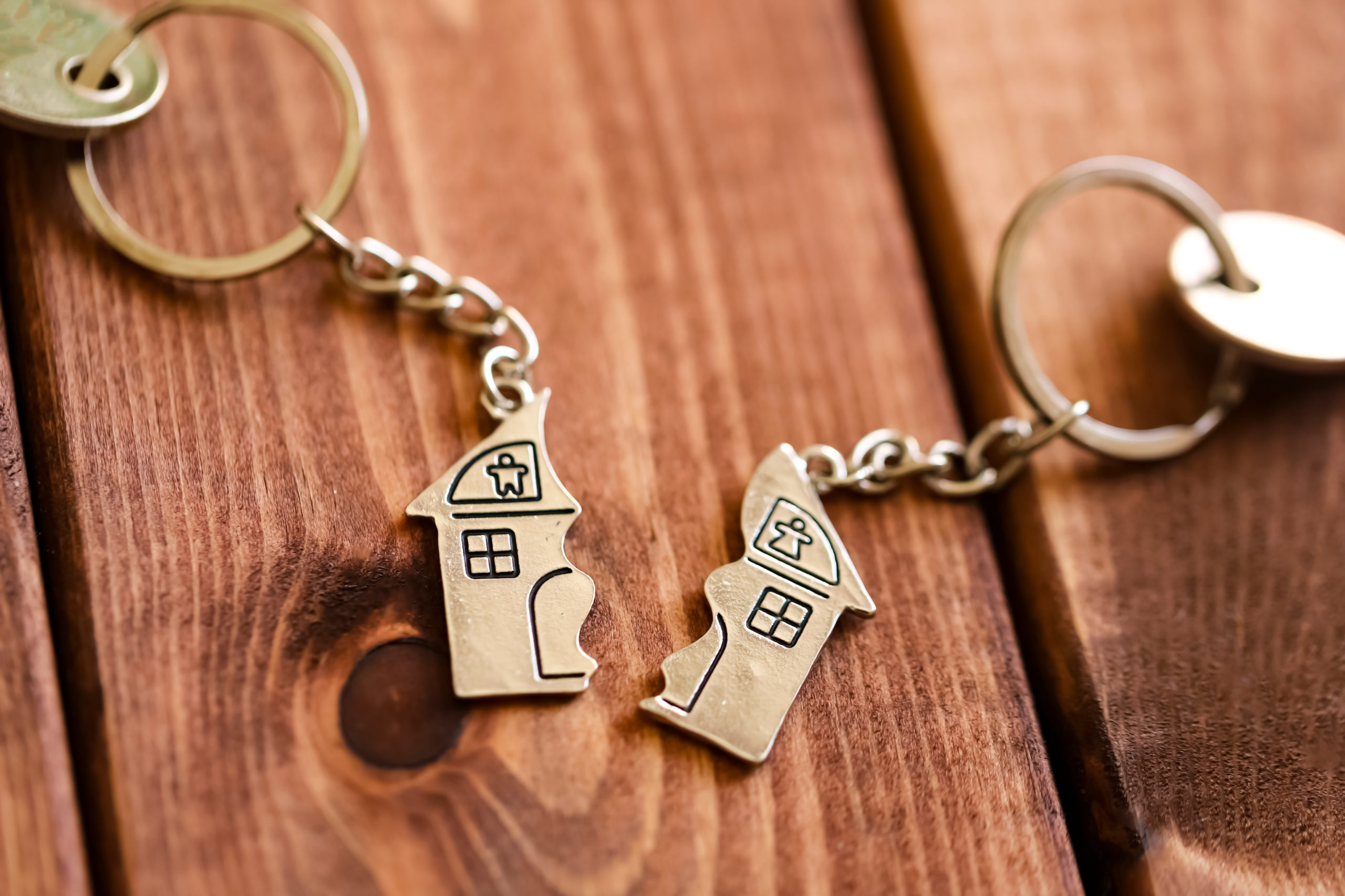 Real Estate Separation After Divorce Concept. Keyholders In Form Of