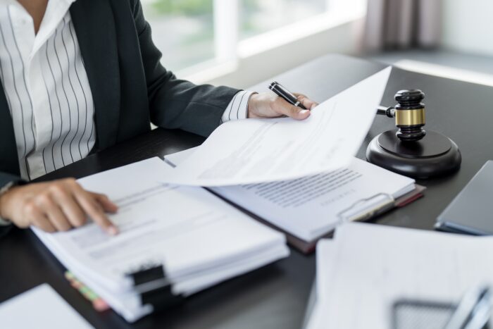 Lawyer,Businessman,Working,With,Lawbook,In,Office,Or,Courtroom,Legal